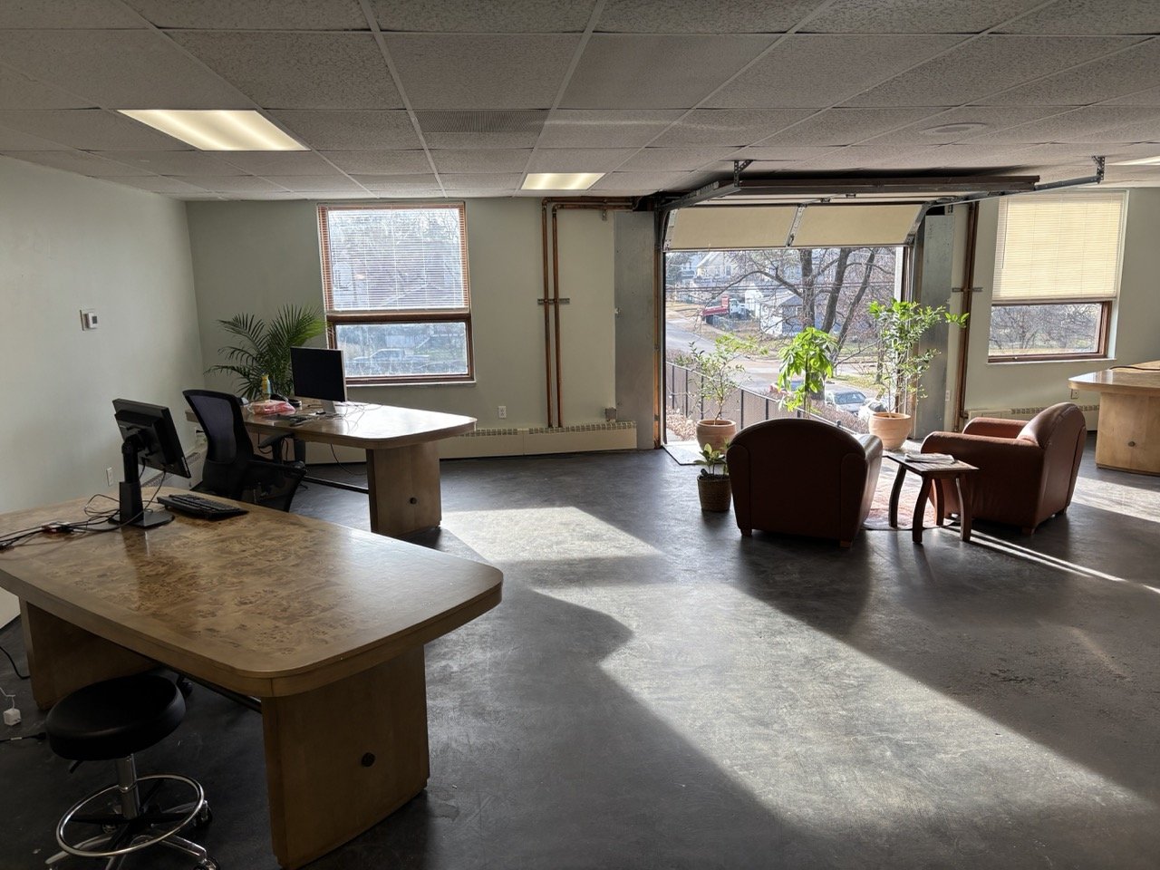 AI Lab Coworking entrance with open garage door