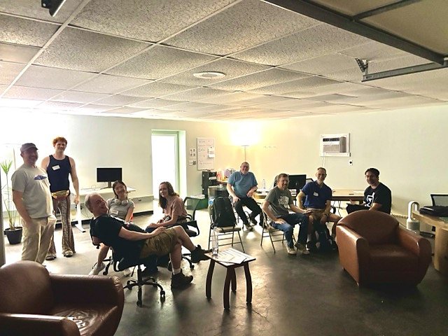 A circle of attendees talking at the March AI Coding Meetup